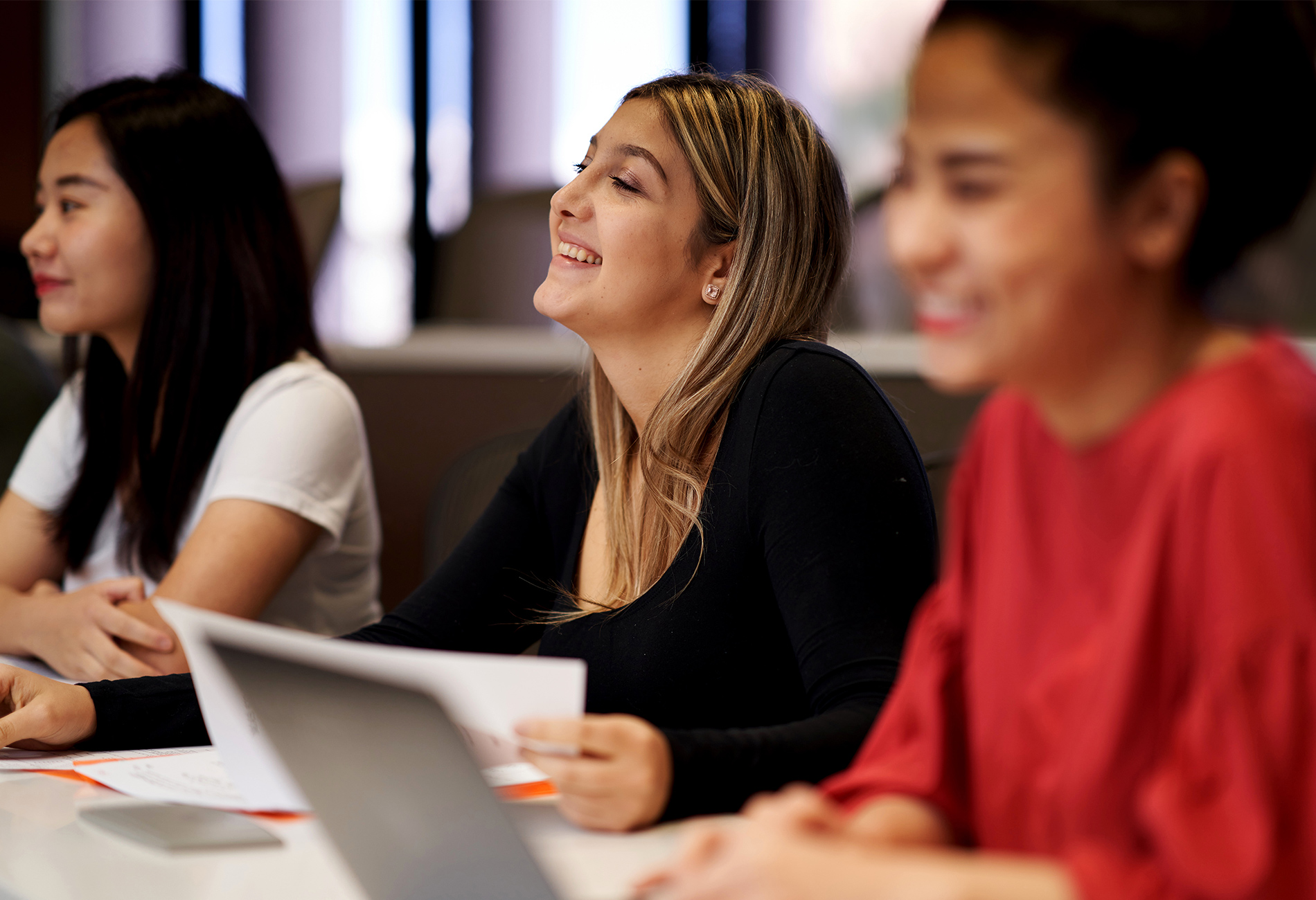 Students in classroom. Ethnically diverse female students in classroom.